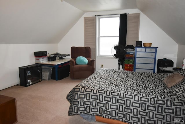 carpeted bedroom with vaulted ceiling