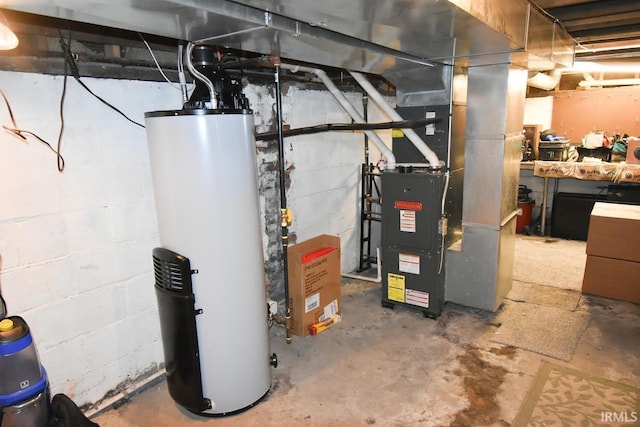 utility room featuring heating unit and gas water heater