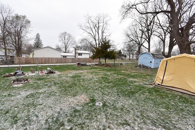 view of yard with an outdoor fire pit