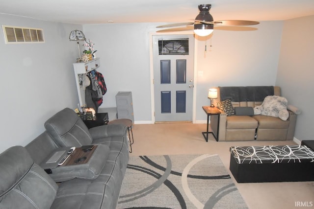 living room featuring light carpet and ceiling fan