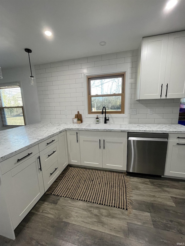 kitchen with sink, white cabinets, and stainless steel dishwasher