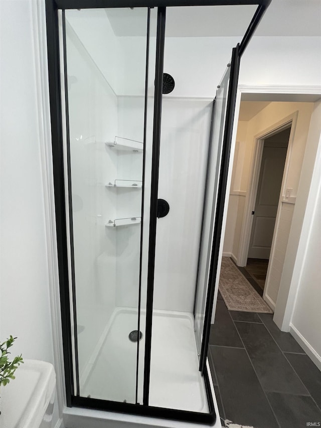 bathroom featuring tile patterned floors and an enclosed shower