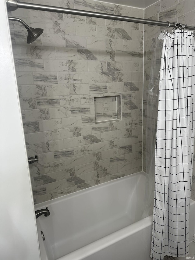 bathroom with shower / bath combo