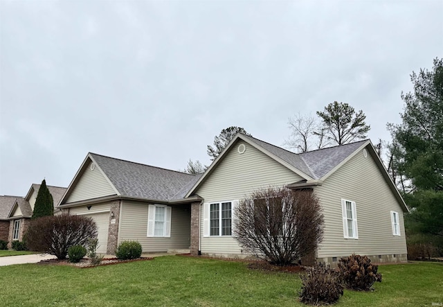 single story home with a garage and a front yard