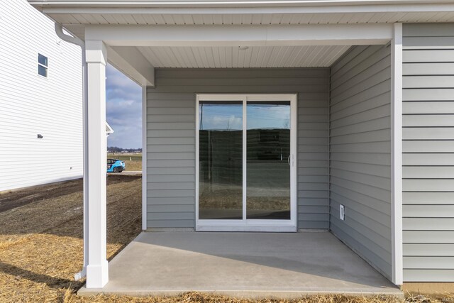 property entrance with a patio area