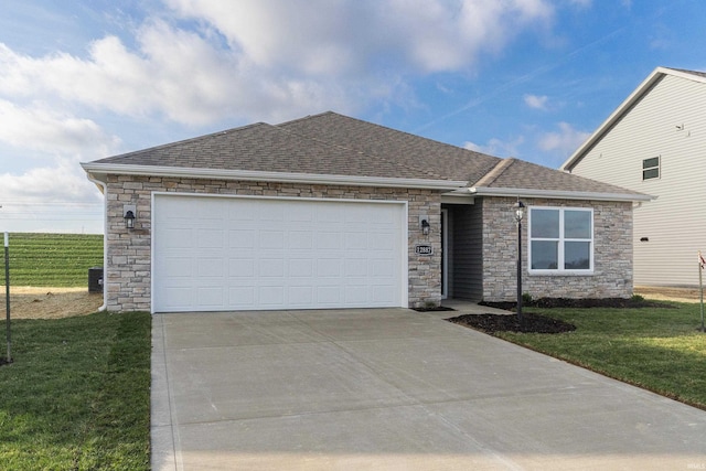 view of front of property with a front lawn and a garage