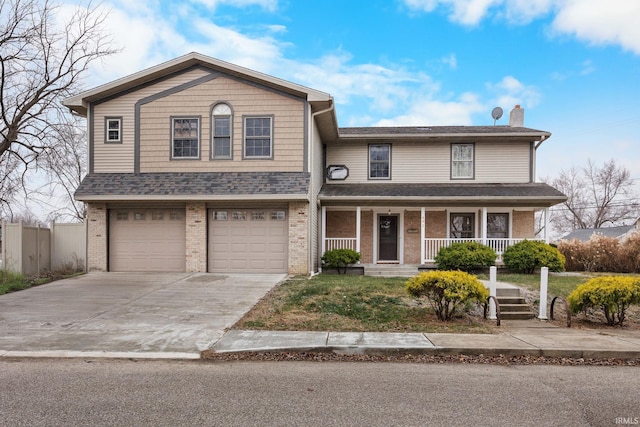 front of property with covered porch and a garage