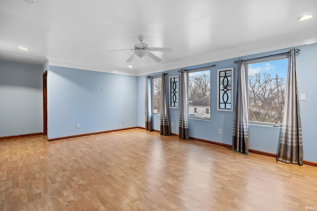 unfurnished room with light hardwood / wood-style flooring, ceiling fan, and ornamental molding