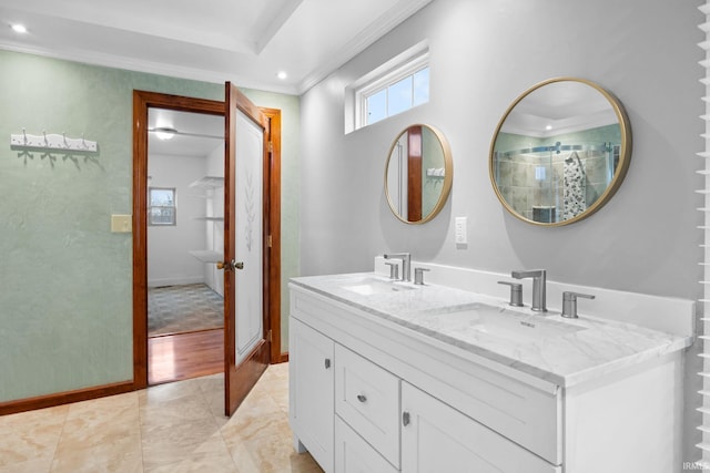 bathroom featuring vanity, hardwood / wood-style flooring, and crown molding