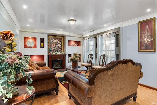 living room with ornamental molding and light wood-type flooring