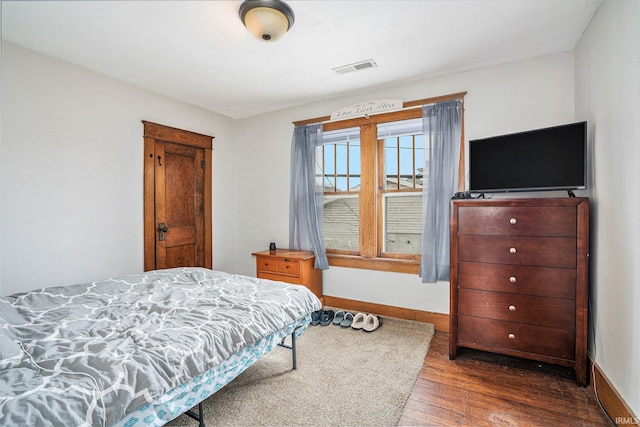 bedroom featuring dark wood-type flooring