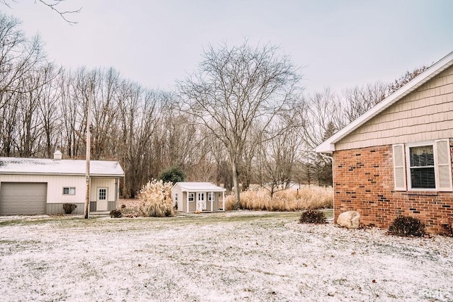 view of yard with an outbuilding and a garage