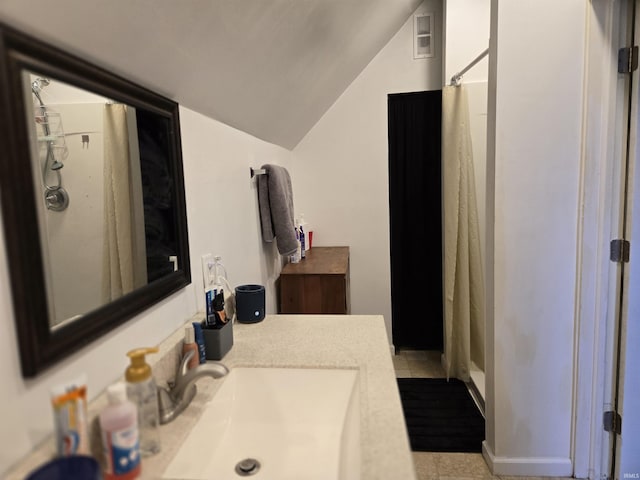 bathroom with tile patterned floors, vanity, lofted ceiling, and a shower with shower curtain