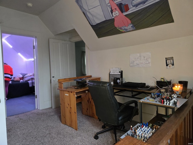 office area featuring light colored carpet and vaulted ceiling