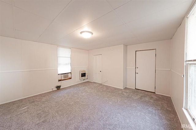 230 Vine St, Mount Vernon, IN 47620 - unfurnished living room featuring heating unit, baseboards, carpet, and cooling unit