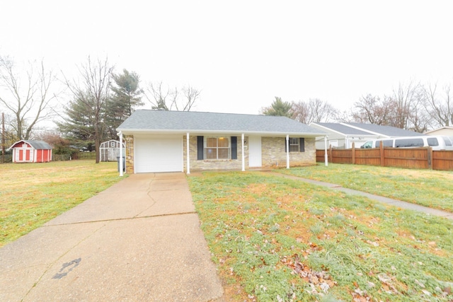 ranch-style house with a storage unit and a front yard