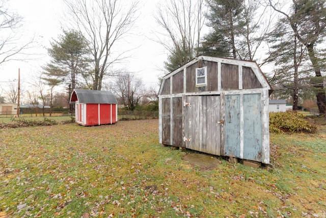 view of outbuilding featuring a lawn