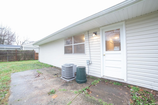 exterior space featuring a lawn, a patio area, and central AC unit