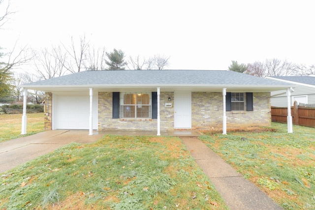 ranch-style home with a porch, a garage, and a front lawn