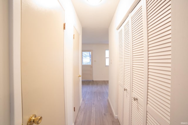 hall with light hardwood / wood-style floors