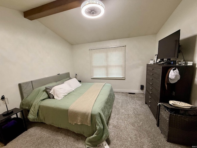 bedroom with vaulted ceiling with beams and light carpet