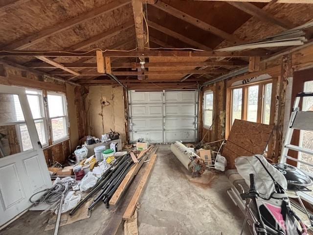 miscellaneous room with a healthy amount of sunlight and vaulted ceiling