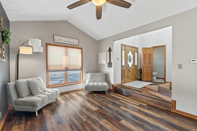 foyer with ceiling fan, dark hardwood / wood-style floors, and vaulted ceiling