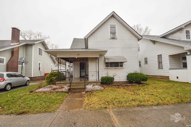 view of front of property with a front lawn and a porch