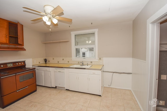 kitchen featuring dishwasher, sink, range with electric cooktop, ceiling fan, and light tile patterned floors