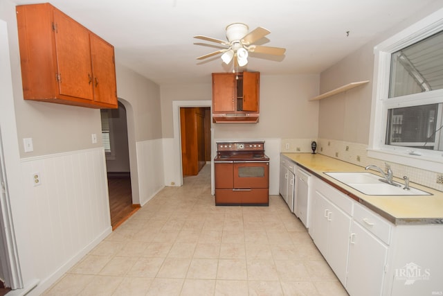 kitchen with electric stove, ceiling fan, sink, and white dishwasher