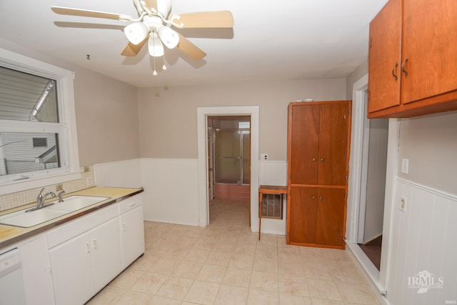 kitchen with dishwasher, ceiling fan, and sink