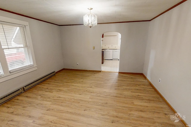 spare room with a chandelier, crown molding, light hardwood / wood-style floors, and a baseboard radiator