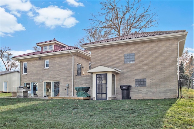 back of house with a yard