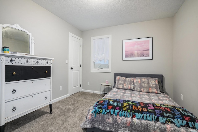 carpeted bedroom with a textured ceiling