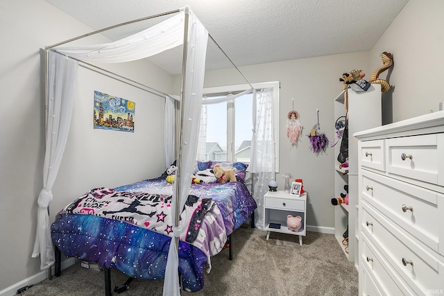 carpeted bedroom featuring a textured ceiling