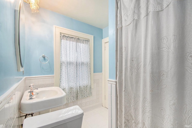 bathroom with tile patterned floors, toilet, and sink