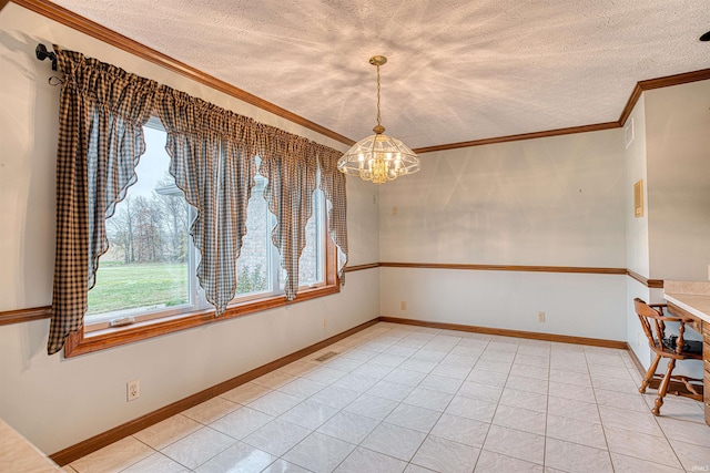 unfurnished dining area featuring ornamental molding, light tile patterned floors, a textured ceiling, and a chandelier