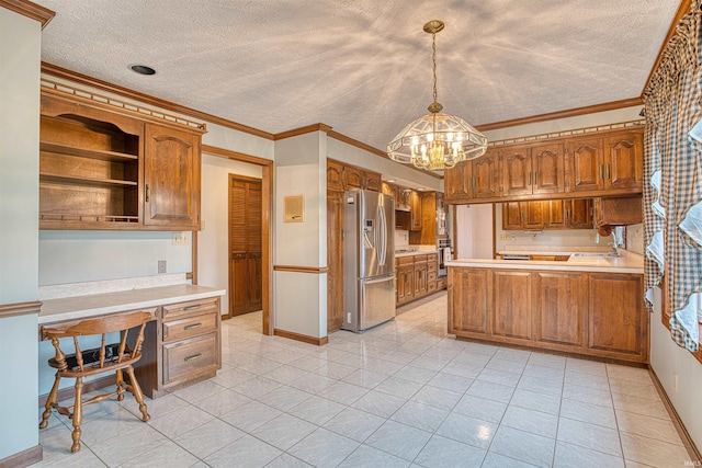 kitchen featuring a textured ceiling, pendant lighting, stainless steel refrigerator with ice dispenser, and ornamental molding