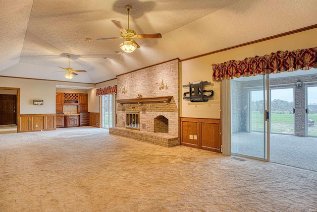 unfurnished living room with a textured ceiling, light carpet, and vaulted ceiling