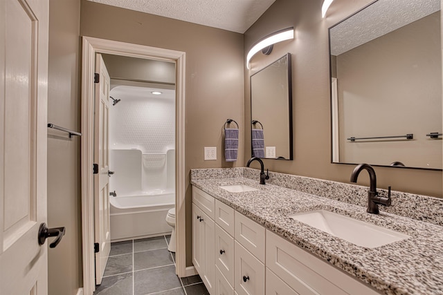 full bathroom with tile patterned floors, shower / bath combination, a textured ceiling, toilet, and vanity