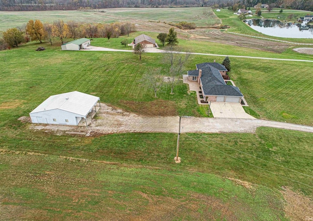 drone / aerial view featuring a rural view and a water view