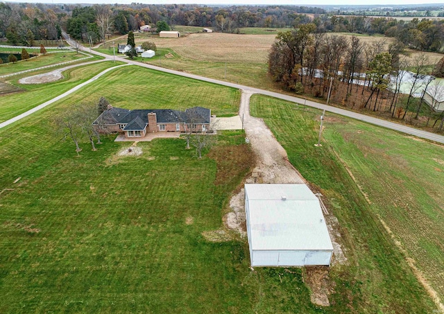 birds eye view of property with a rural view