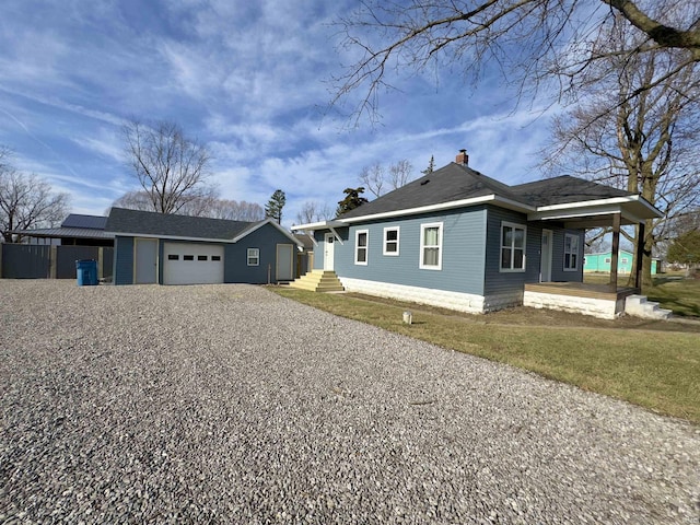 view of front of house featuring a front yard and a garage