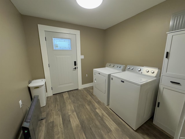 washroom featuring wood-type flooring and separate washer and dryer