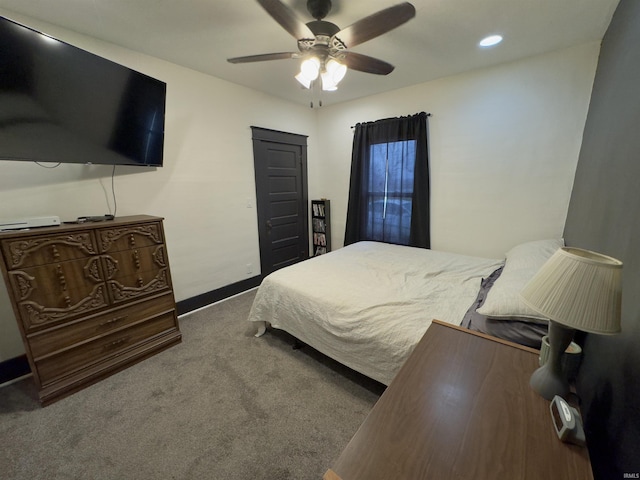 carpeted bedroom featuring ceiling fan