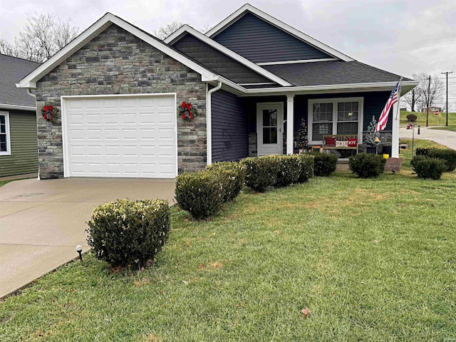 view of front of home featuring a porch, a garage, and a front lawn