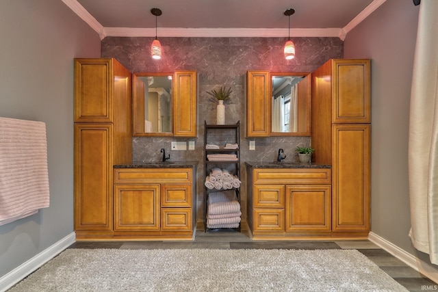 bar with pendant lighting, backsplash, sink, and crown molding