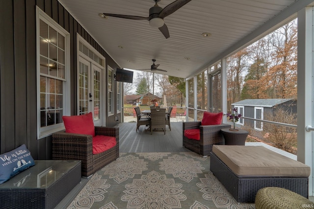 394 W Evergreen Plz, Santa Claus, IN 47579 - wooden terrace with outdoor dining space, ceiling fan, french doors, and a shed