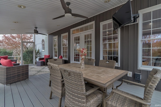 wooden deck with an outdoor hangout area and ceiling fan