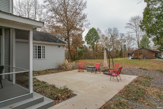 view of patio / terrace featuring a shed